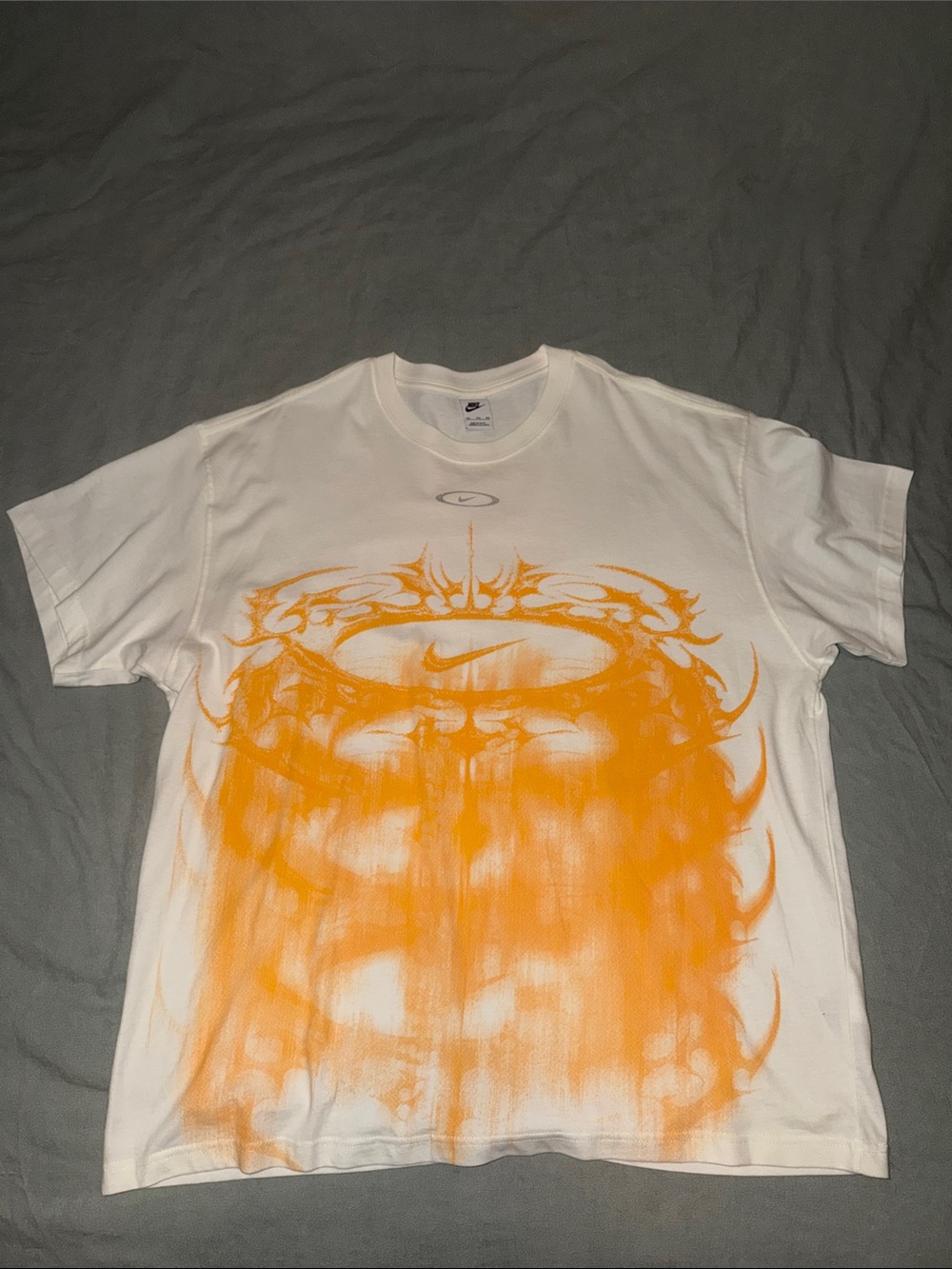 Nike White Short-Sleeve Tee with Vibrant Orange Front Graphic